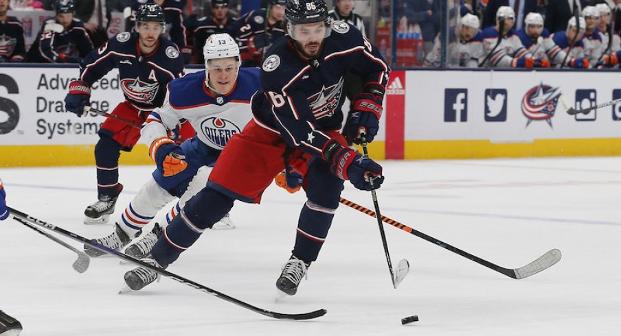 Columbus Blue Jackets' Kirill Marchenko controls the puck as Edmonton Oilers' Jesse Puljujarvi trails the play during the second period at Nationwide Arena.