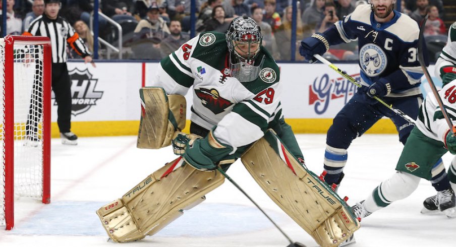 Minnesota Wild's Marc-Andre Fleury clears a loose puck against the Columbus Blue Jackets during the second period at Nationwide Arena.