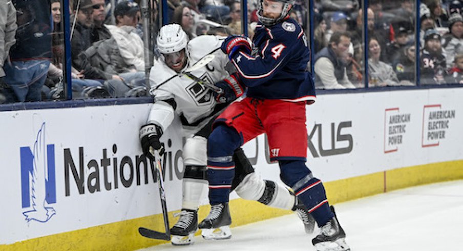 Vladislav Gavrikov checks Anze Kopitar in the Kings vs. Blue Jackets game.