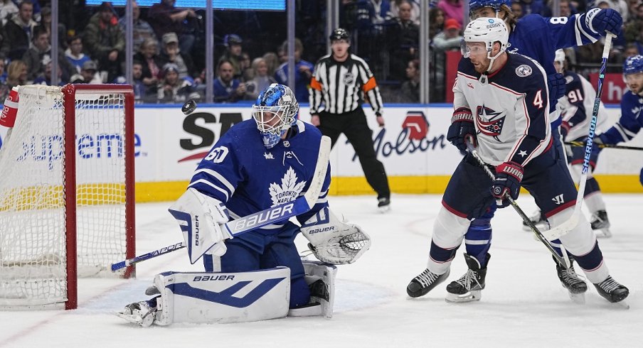 Vladislav Gavrikov looks for the puck against the Toronto Maple Leafs