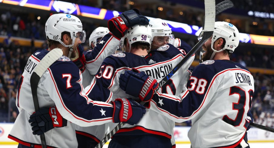 Columbus Blue Jackets' Eric Robinson celebrates his goal with teammates during the third period against the Buffalo Sabres at KeyBank Center.