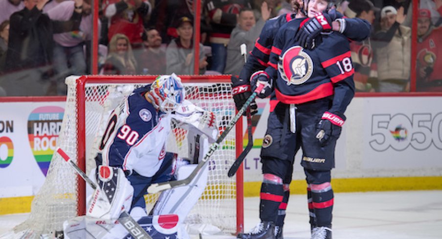 Tim Stutzle celebrates after scoring a goal in the Blue Jackets vs. Senators game.