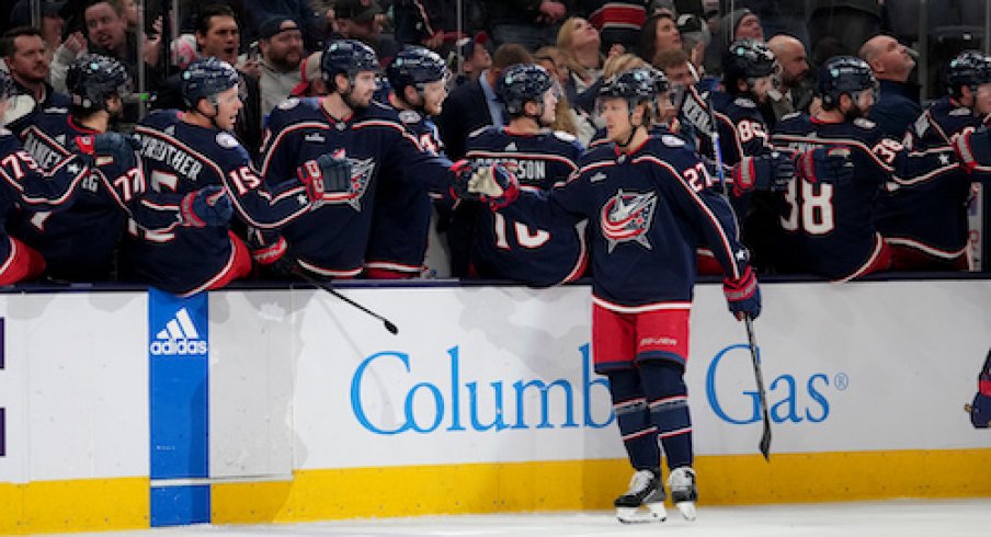 Adam Boqvist celebrates after scoring a goal in the Kraken vs. Blue Jackets game.