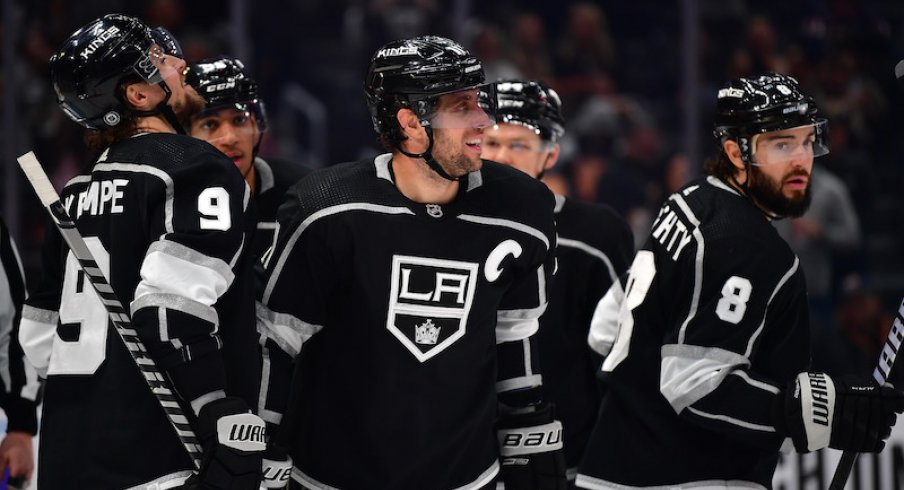 Los Angeles Kings' Anze Kopitar celebrates his goal scored against the Columbus Blue Jackets with Adrian Kempe and Drew Doughty during the second period at Crypto.com Arena.