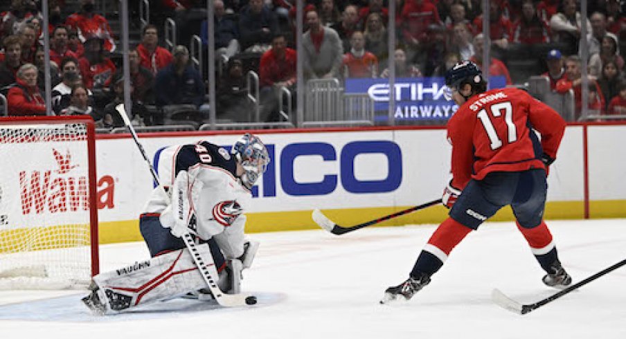 Daniil Tarasov stops Dylan Strome's shot in the Blue Jackets vs. Capitals game.