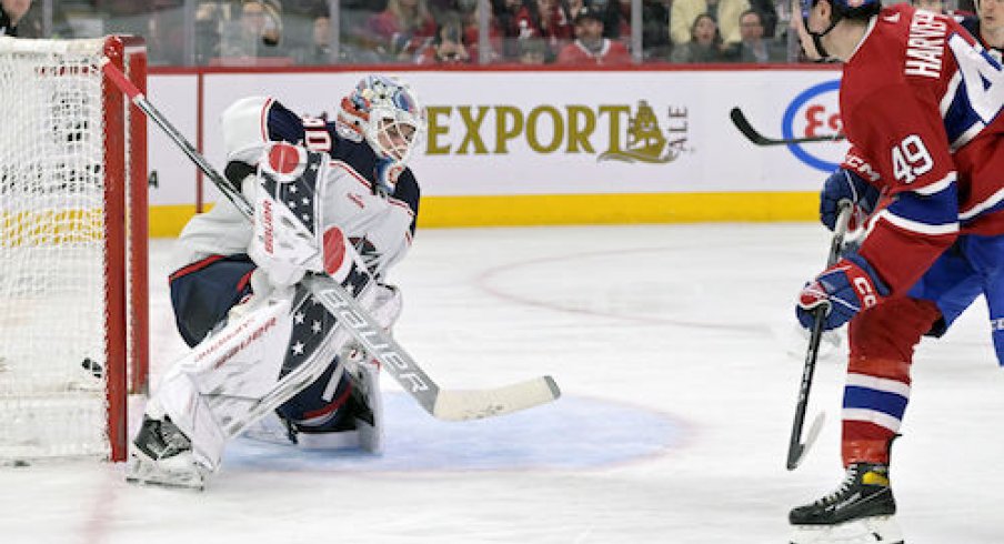Rafael Harvey-Pinard scores a goal in the Blue Jackets vs. Canadiens game.