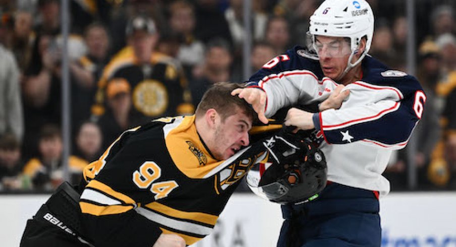 Billy Sweezey and Jakub Lauko fight in the Blue Jackets vs. Bruins game.