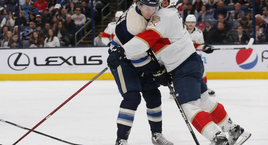 Radko Gudas hits Hunter McKown in the Panthers vs. Blue Jackets game.