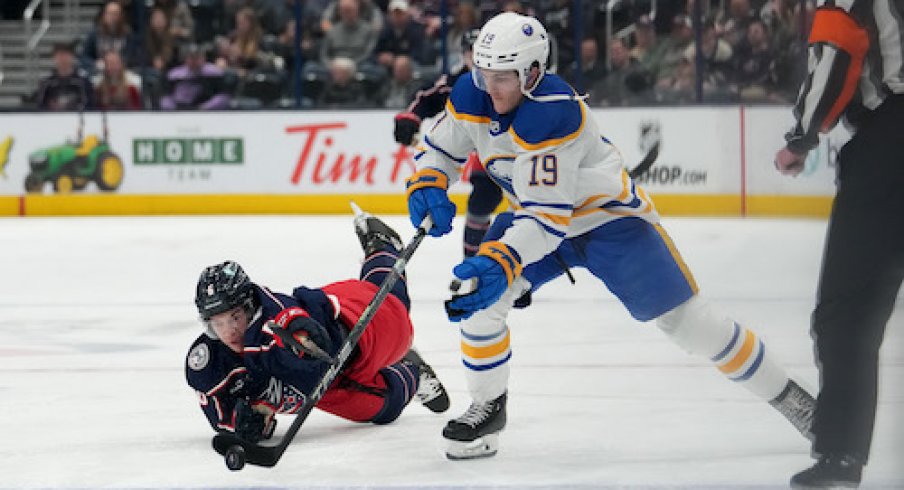 Buffalo Sabres center Peyton Krebs (19) skates with the puck while Columbus Blue Jackets defenseman Billy Sweeney (6) defends during the first period at Nationwide Arena.