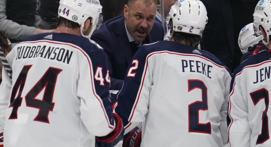 Brad Larsen talks to his players during a Blue Jackets game