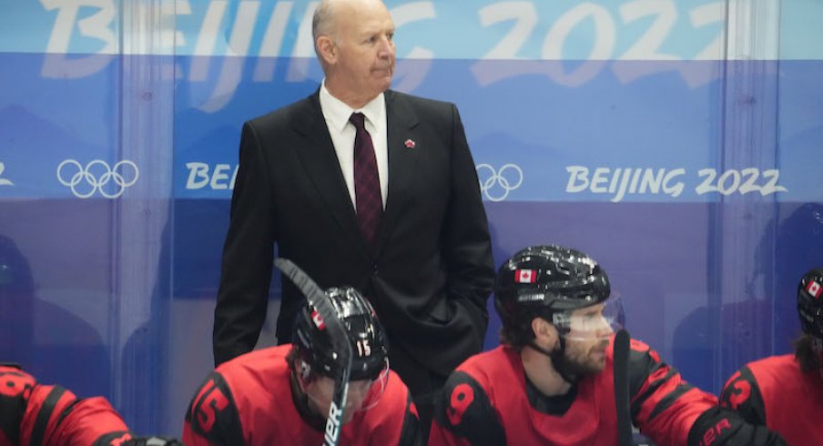 Team Canada head coach Claude Julien against Team USA during the third period in the men's ice hockey preliminary round of the Beijing 2022 Olympic Winter Games at National Indoor Stadium.
