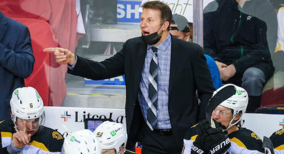 Boston Bruins assistant coach Joe Sacco on his bench against the Calgary Flames during the third period at Scotiabank Saddledome.