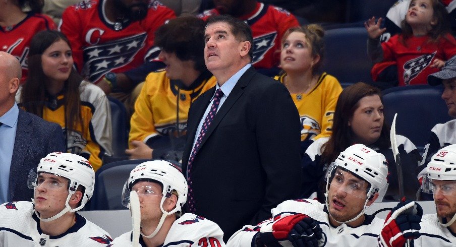 Washington Capitals head coach Peter Laviolette watches from the bench during the first period against the Nashville Predators at Bridgestone Arena.