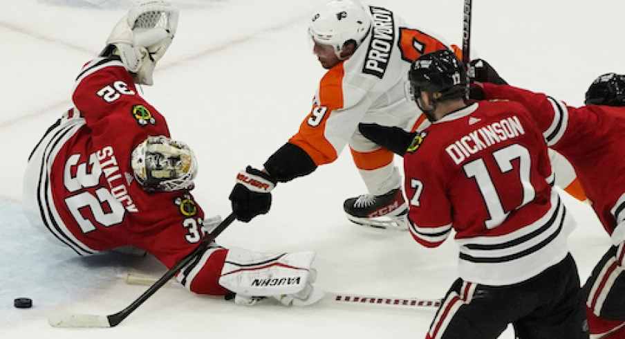 Philadelphia Flyers defenseman Ivan Provorov (9) scores a goal on Chicago Blackhawks goaltender Alex Stalock (32) during overtime at United Center.