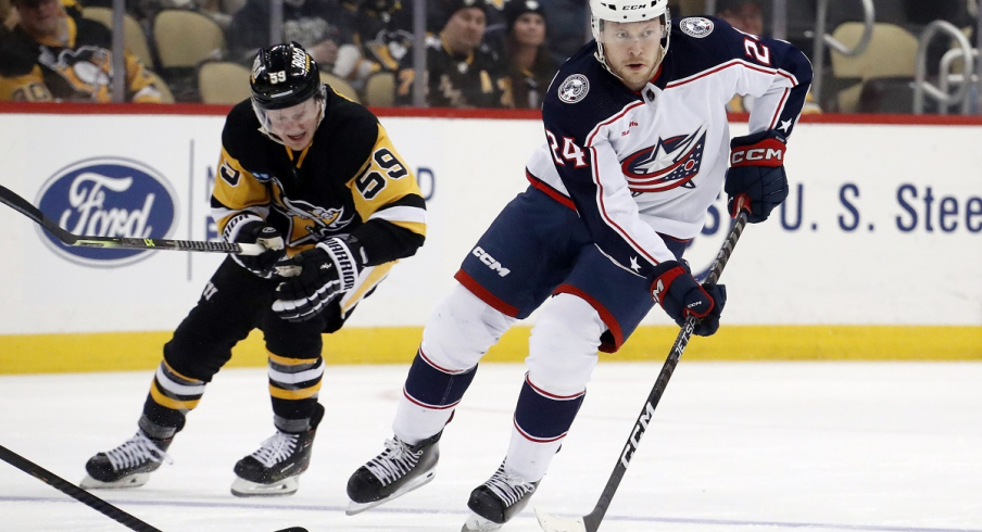 Mathieu Olivier skates with the puck against the Pittsburgh Penguins