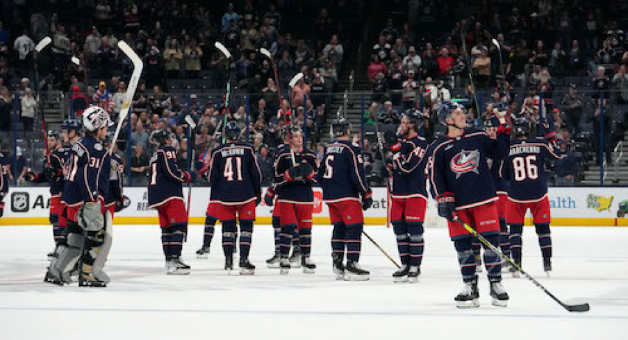 Columbus Blue Jackets players celebrate after the game against the Buffalo Sabres at Nationwide Arena.