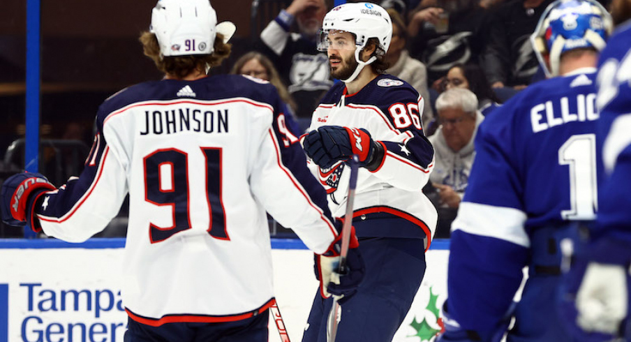 Columbus Blue Jackets' Kirill Marchenko is congratulated by Columbus Blue Jackets' Kent Johnson after he scored a goal against the Tampa Bay Lightning during the second period at Amalie Arena.
