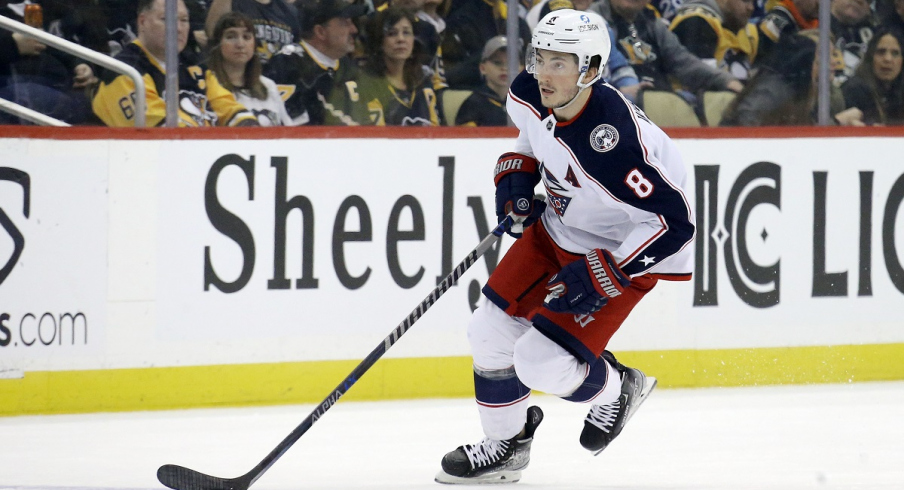 Columbus Blue Jackets defenseman Zach Werenski skates with the puck against the Pittsburgh Penguins