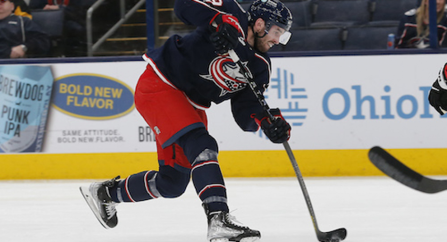 Columbus Blue Jackets center Liam Foudy (19) shoots on goal against the Pittsburgh Penguins during the second period at Nationwide Arena.