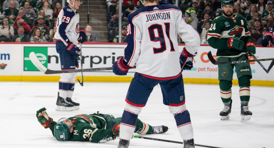 Minnesota Wild's Mats Zuccarello lays down on the ice in front of Columbus Blue Jackets' Kent Johnson in the second period at Xcel Energy Center.