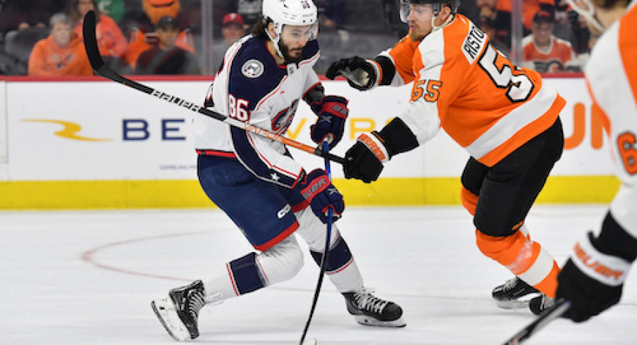 Columbus Blue Jackets right wing Kirill Marchenko (86) is defended by Philadelphia Flyers defenseman Rasmus Ristolainen (55) during the first period at Wells Fargo Center.