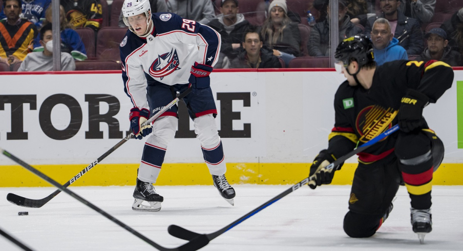 Patrik Laine looks to pass against the Vancouver Canucks