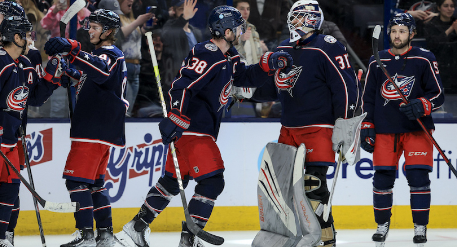 Columbus Blue Jackets' Boone Jenner celebrates with teammate Michael Hutchinson after scoring the game-winning goal against the New York Islanders in the overtime period at Nationwide Arena.