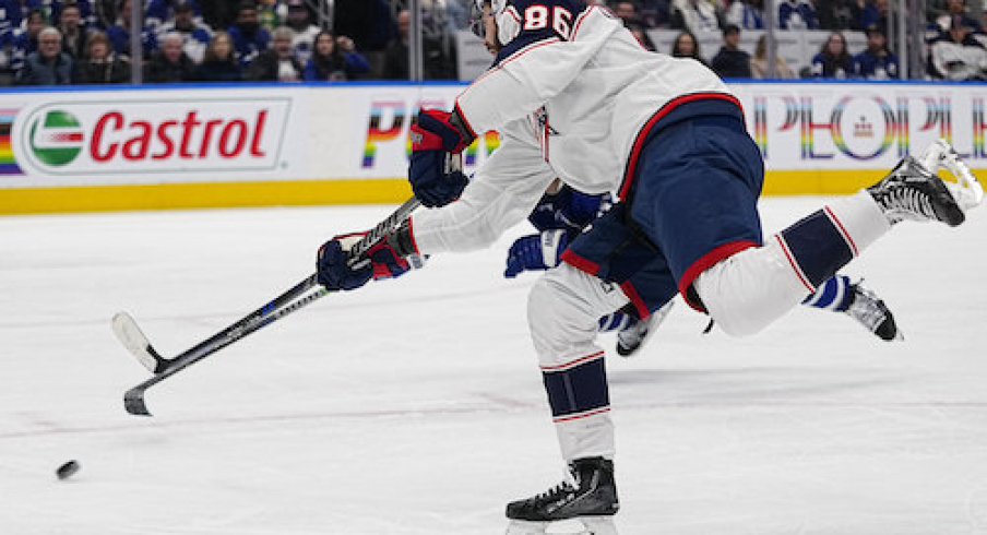 Columbus Blue Jackets forward Kirill Marchenko (86) shoots the puck against the Toronto Maple Leafs during the second period at Scotiabank Arena.
