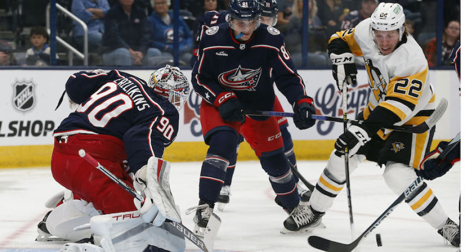 Pittsburgh Penguins' Sam Poulin reaches for the rebound of Columbus Blue Jackets' Elvis Merzlikins save during the first period at Nationwide Arena.