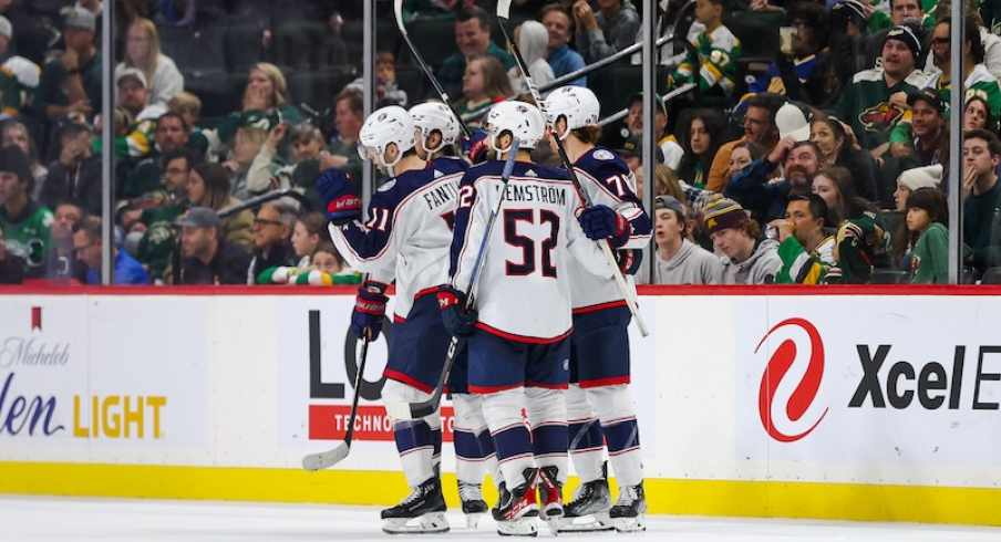 Columbus Blue Jackets' Adam Fantilli celebrates his goal against the Minnesota Wild with teammates during the third period at Xcel Energy Center.