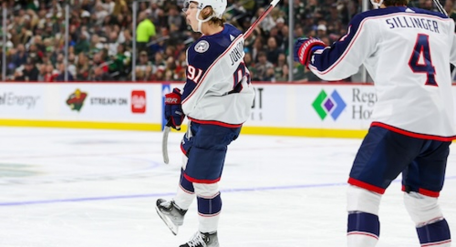 Columbus Blue Jackets center Kent Johnson (91) celebrates his goal against the Minnesota Wild during the second period at Xcel Energy Center. 