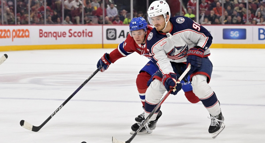 Jack Roslovic skates with the puck against the Montreal Canadiens 