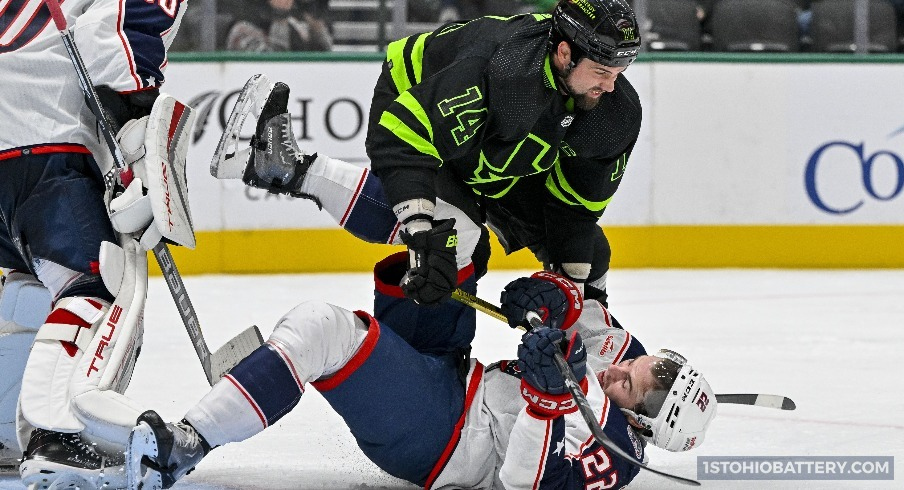 Jake Bean is on the receiving end of a check in a 5-3 loss to the Dallas Stars.