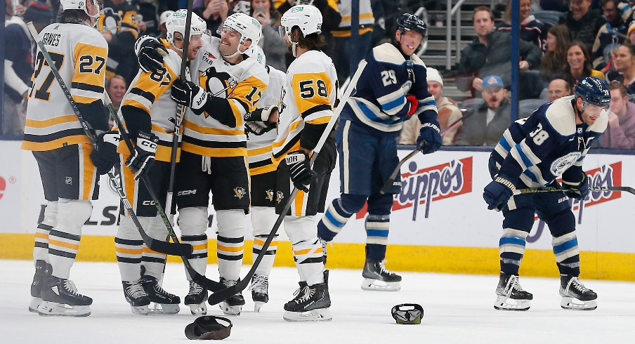 Pittsburgh Penguins center Sidney Crosby (87) celebrates his hat trick goal during the third period against the Columbus Blue Jackets at Nationwide Arena.