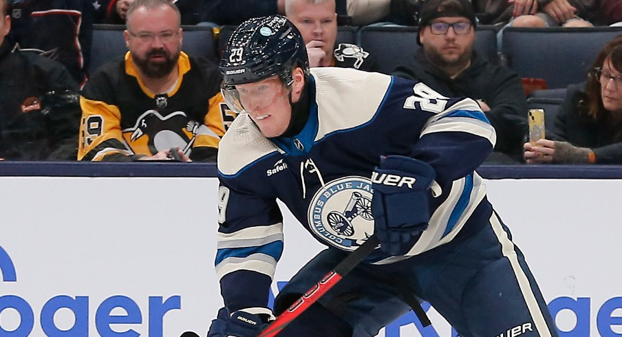 Columbus Blue Jackets right wing Patrik Laine (29) carries the puck away from Pittsburgh Penguins defenseman Kris Letang (58) during the third period at Nationwide Arena.