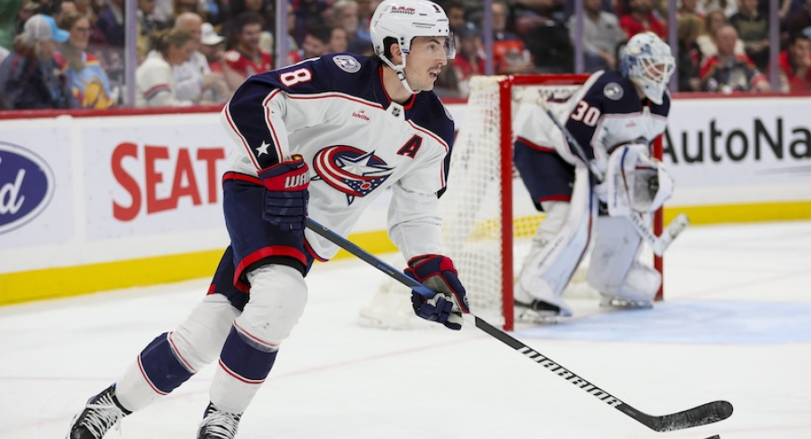 Columbus Blue Jackets' Zach Werenski moves the puck against the Florida Panthers during the second period at Amerant Bank Arena.