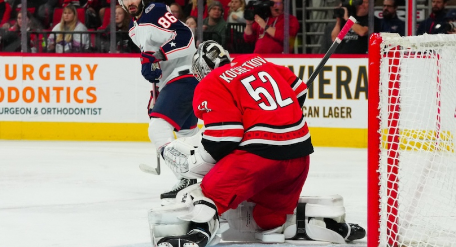 Carolina Hurricanes' Pyotr Kochetkov makes the save in front of Columbus Blue Jackets' Kirill Marchenko during the second period at PNC Arena.