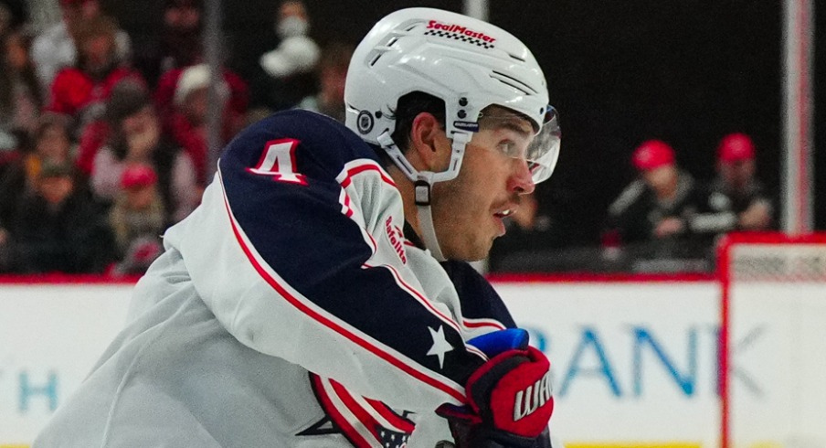 Columbus Blue Jackets center Cole Sillinger (4) watches his shot against the Carolina Hurricanes during the second period at PNC Arena.