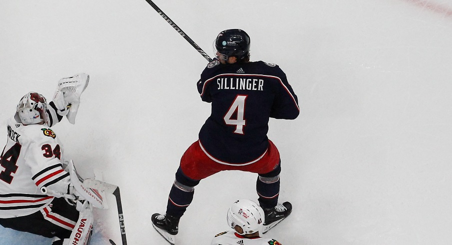 Columbus Blue Jackets Forward Cole Sillinger (4) tips the puck past Chicago Blackhawks goalie Petr Mrazek (34) for a goal during the second period at Nationwide Arena.