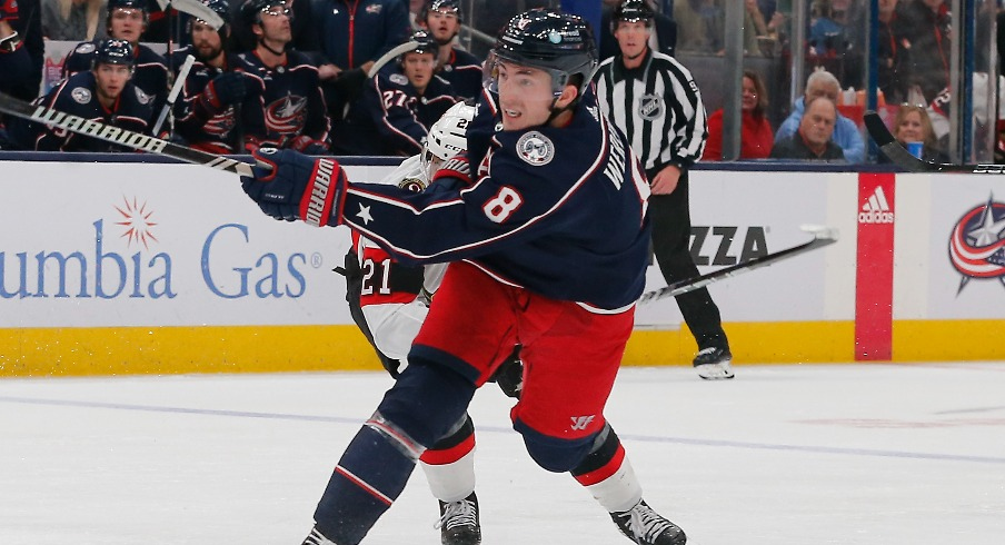 Columbus Blue Jackets defenseman Zach Werenski (8) follows though on a shot against the Ottawa Senators during the second period at Nationwide Arena.