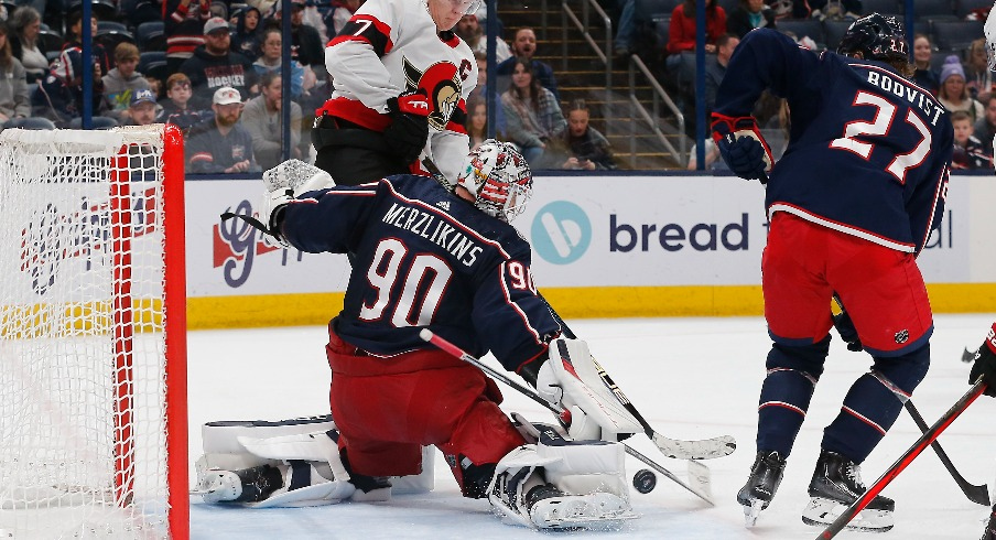 Columbus Blue Jackets goalie Elvis Merzlikins (90) makes a pad save against the Ottawa Senators during the third period at Nationwide Arena.