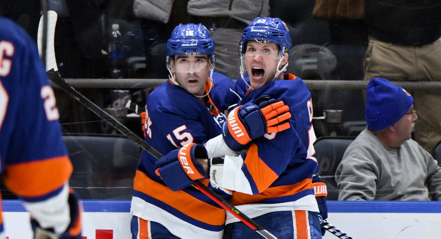 New York Islanders right wing Cal Clutterbuck (15) celebrates with New York Islanders center Casey Cizikas (53) after scoring a goal against the Columbus Blue Jackets during the second period at UBS Arena.