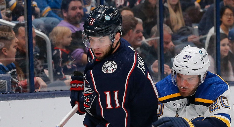 Columbus Blue Jackets center Adam Fantilli (11) picks up a loose puck as St. Louis Blues left wing Brandon Saad (20) trails the play during the first period at Nationwide Arena.