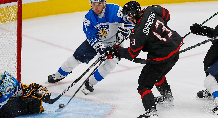 Team Canada forward Kent Johnson (13) scores the overtime winning goal against Team Finland in the championship game during the IIHF U20 Ice Hockey World Championship at Rogers Place.