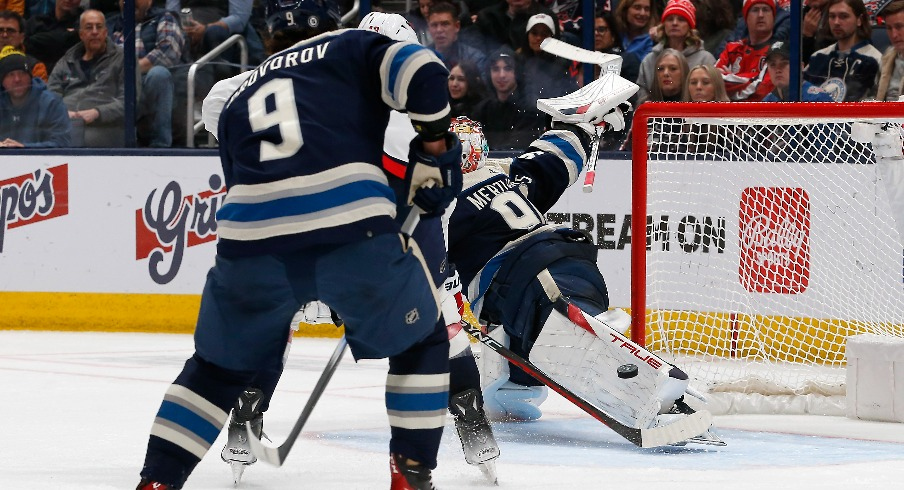 Columbus Blue Jackets goalie Elvis Merzlikins (90) makes a pad save against the Washington Capitals during the second period at Nationwide Arena.