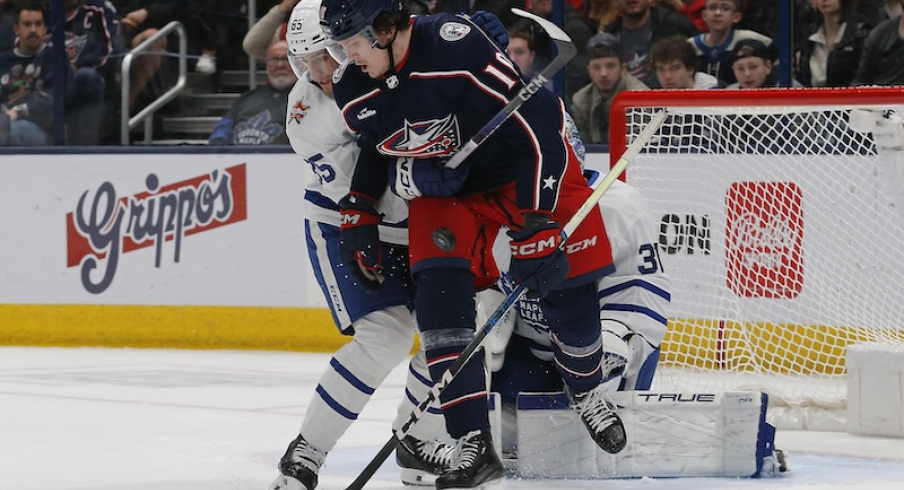 Columbus Blue Jackets' Dmitri Voronkov has a shot attempt hit him against the Toronto Maple Leafs during the first period at Nationwide Arena.