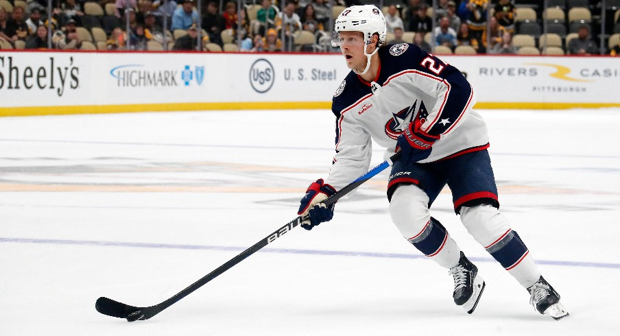 Columbus Blue Jackets defenseman Adam Boqvist (27) skates with the puck against the Pittsburgh Penguins in the shootout at PPG Paints Arena.