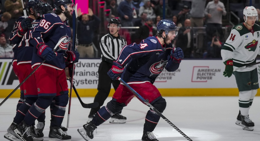 Columbus Blue Jackets' Cole Sillinger celebrates with teammates after scoring a hat-trick goal against the Minnesota Wild in the third period at Nationwide Arena.