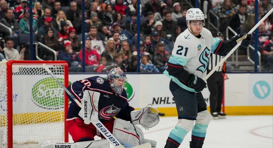 Columbus Blue Jackets goaltender Daniil Tarasov (40) attempts a save as he is screened by Seattle Kraken center Alex Wennberg (21) in the second period at Nationwide Arena.