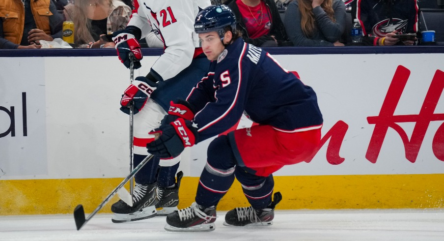 Washington Capitals center Aliaksei Protas (21) passes the puck against Columbus Blue Jackets defenseman Denton Mateychuk (5) in the first period at Nationwide Arena.
